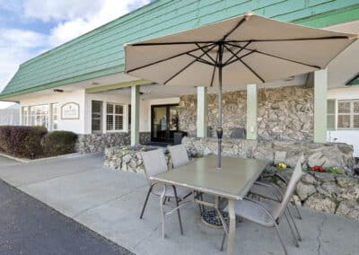 Outside patio with seating and sun shades